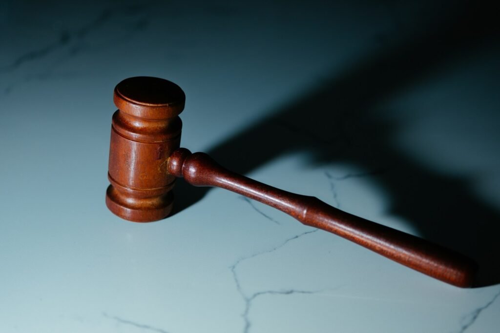 LexGlobal contacto a wooden judge's hammer sitting on top of a table